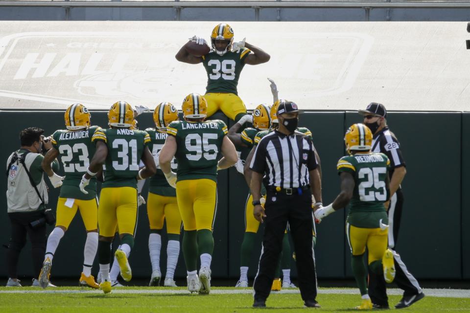 Green Bay Packers' Chandon Sullivan celebrates his interception and touchdown return during the second half of an NFL football game against the Detroit Lions Sunday, Sept. 20, 2020, in Green Bay, Wis. (AP Photo/Mike Roemer)