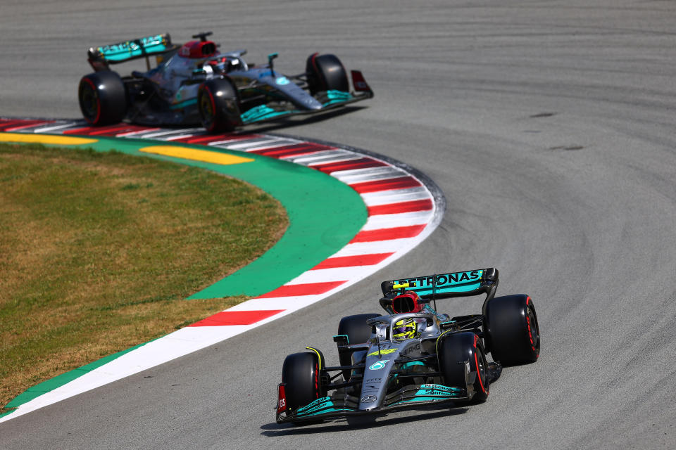 BARCELONA, SPAIN - MAY 21: Lewis Hamilton of Great Britain driving the (44) Mercedes AMG Petronas F1 Team Mercedes W13 followed by George Russell of Great Britain driving the (63) Mercedes AMG Petronas F1 Team Mercedes W13 during qualifying ahead of the Formula 1 Grand Prix of Spain at Circuit de Barcelona-Catalunya on May 21, 2022 in Barcelona, Spain. (Photo by Eric Alonso/Getty Images)