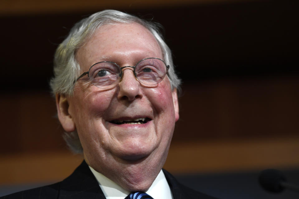 Senate Majority Leader Mitch McConnell of Ky., smiles during a news conference on Capitol Hill in Washington, Wednesday, Feb. 5, 2020, following a vote in the Senate to acquit President Donald Trump on both articles of impeachment. (AP Photo/Susan Walsh)