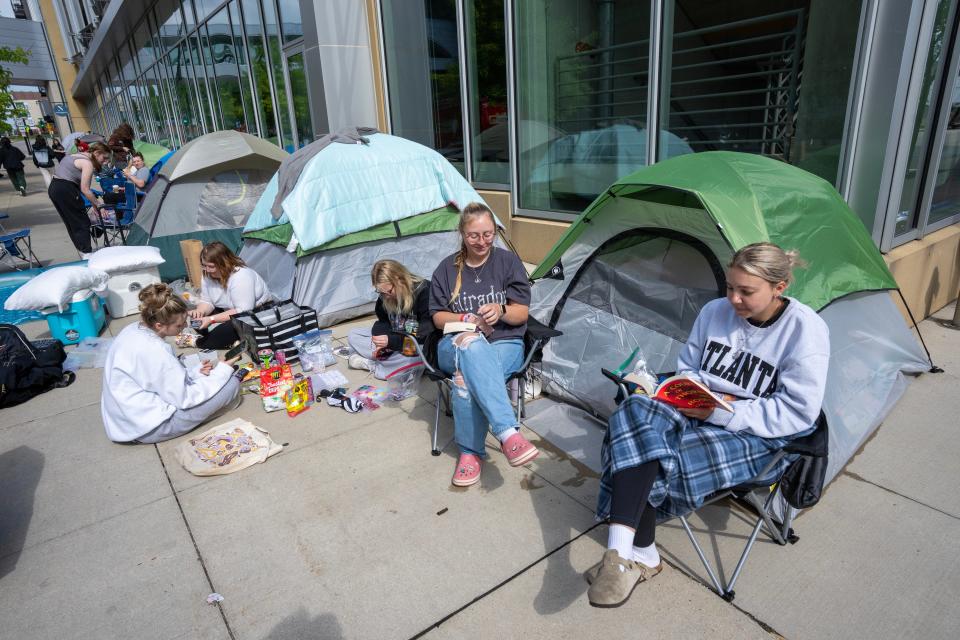 Fans wait in line to be be in the “pit” for the upcoming Greta Van Fleet concert Monday, May 20, 2024 across the street from Fiserv Forum in Milwaukee, Wisconsin. Dozens of fans have camped out along Juneau Ave. to see the Michigan rockers on the final stop of their tour Tuesday at Fiserv Forum with the band Geese opening. The fans will wait in line until 10 a.m. Tuesday, when they will be guaranteed a spot in the pit for the show that night.