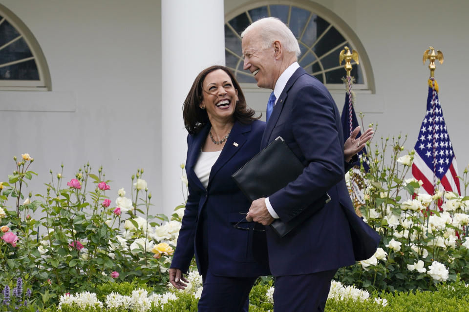 FILE - President Joe Biden, right, walks with Vice President Kamala Harris after speaking on updated guidance on face mask mandates and COVID-19 response, in the Rose Garden of the White House, May 13, 2021, in Washington. President Joe Biden dropped out of the 2024 race for the White House on Sunday, July 21, ending his bid for reelection following a disastrous debate with Donald Trump that raised doubts about his fitness for office just four months before the election. (AP Photo/Evan Vucci)