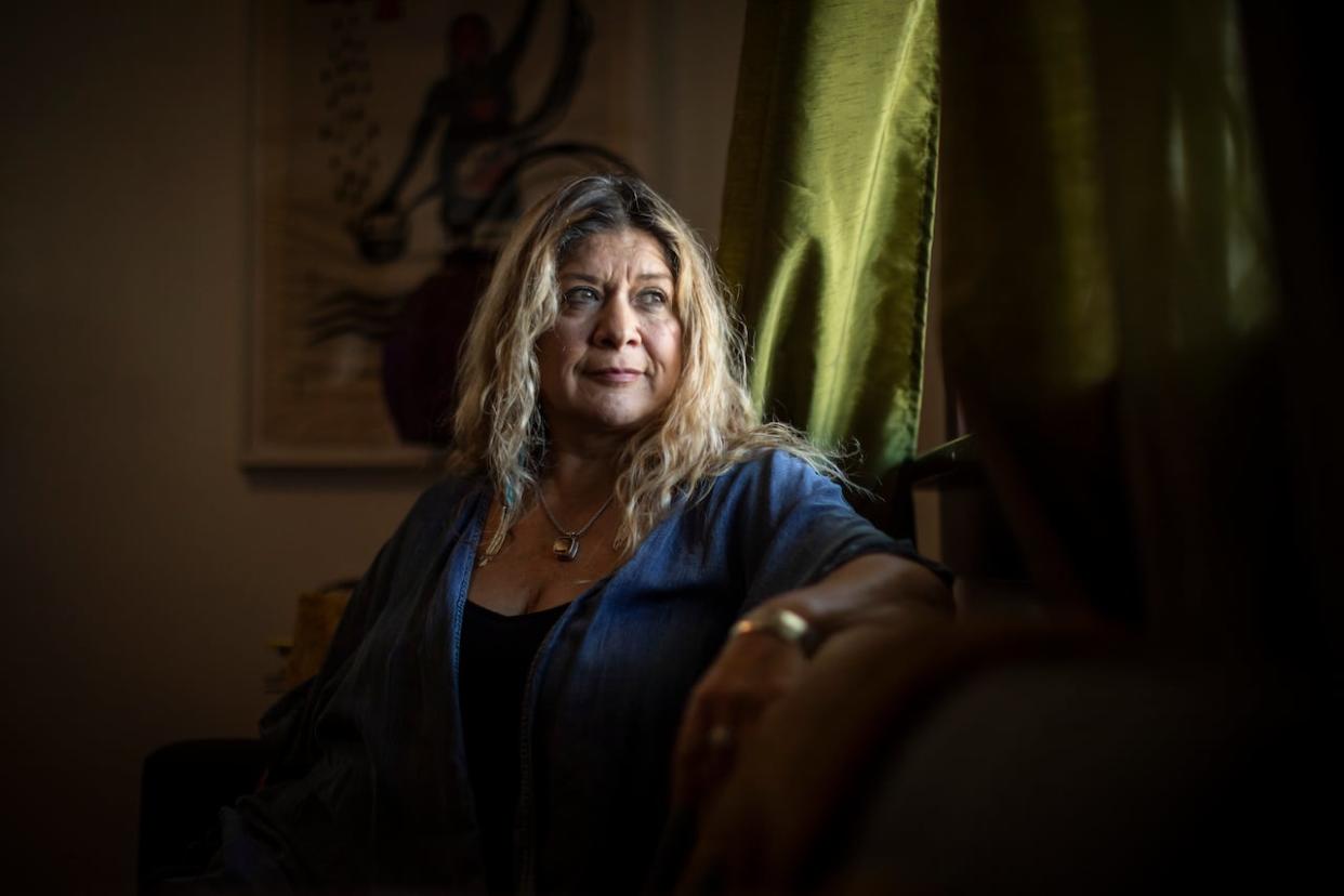 Gisselle Del Carmen Vivanco Leiva, pictured in her Burnaby home on Thursday, is one of nearly 7,000 Chileans who settled in Canada after a 1973 coup d'etat.  (Ben Nelms/CBC - image credit)