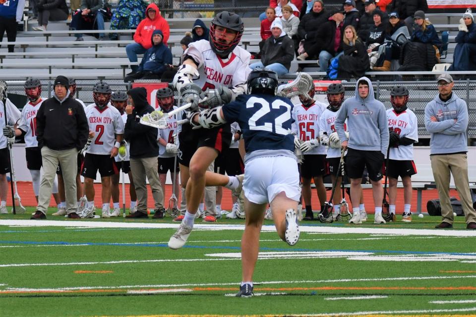 Ocean City sophomore Pat Grimley shoots over St. Agustine junior Jack Schleichter