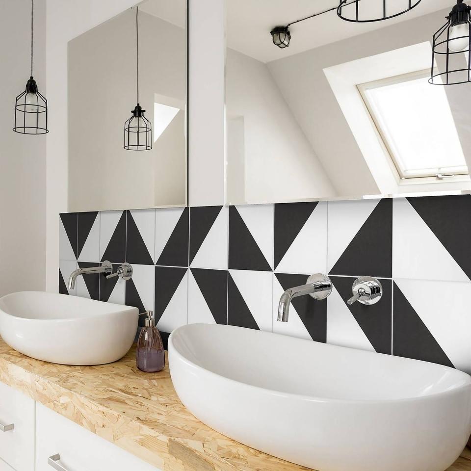 <p>If you're fortunate enough to have plenty of <a href="https://www.housebeautiful.com/uk/decorate/a1770/ways-to-bring-natural-light-into-home/" rel="nofollow noopener" target="_blank" data-ylk="slk:natural light;elm:context_link;itc:0;sec:content-canvas" class="link ">natural light</a> in your bathroom, there may be a temptation to keep your colours light and bright too, but this is the perfect opportunity to use black. Glossy tiles will of course bounce your light around, but if you're fond of matt tiles, placing mirrors adjacent will do the same job. </p><p><strong>Pictured: <a href="https://www.homebase.co.uk/house-beautiful-cube-mono-porcelain-wall-floor-tile-200-x-200mm-0.52sqm-pack/13220595.html" rel="nofollow noopener" target="_blank" data-ylk="slk:House Beautiful Cube Mono Porcelain Tile at Homebase;elm:context_link;itc:0;sec:content-canvas" class="link ">House Beautiful Cube Mono Porcelain Tile at Homebase</a></strong></p><p><strong>Follow House Beautiful on </strong><a href="https://www.tiktok.com/@housebeautifuluk" rel="nofollow noopener" target="_blank" data-ylk="slk:TikTok;elm:context_link;itc:0;sec:content-canvas" class="link "><strong>TikTok</strong></a><strong> and </strong><a href="https://www.instagram.com/housebeautifuluk/" rel="nofollow noopener" target="_blank" data-ylk="slk:Instagram;elm:context_link;itc:0;sec:content-canvas" class="link "><strong>Instagram</strong></a><strong>.</strong></p>