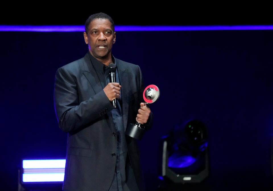 Denzel Washington accepts CinemaCon 2023's lifetime achievement award during the Sony Pictures presentation.