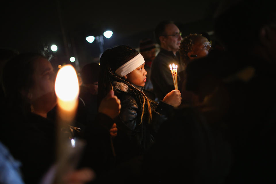 Demonstrators hold a prayer service near the police station on March 12, 2015 in Ferguson, Missouri. Prayers were said for both demonstrators and police at the service. Yesterday two police officers were shot while observing a protest outside the police station. Ferguson has faced many violent protests since the August shooting death of Michael Brown by a Ferguson police officer.