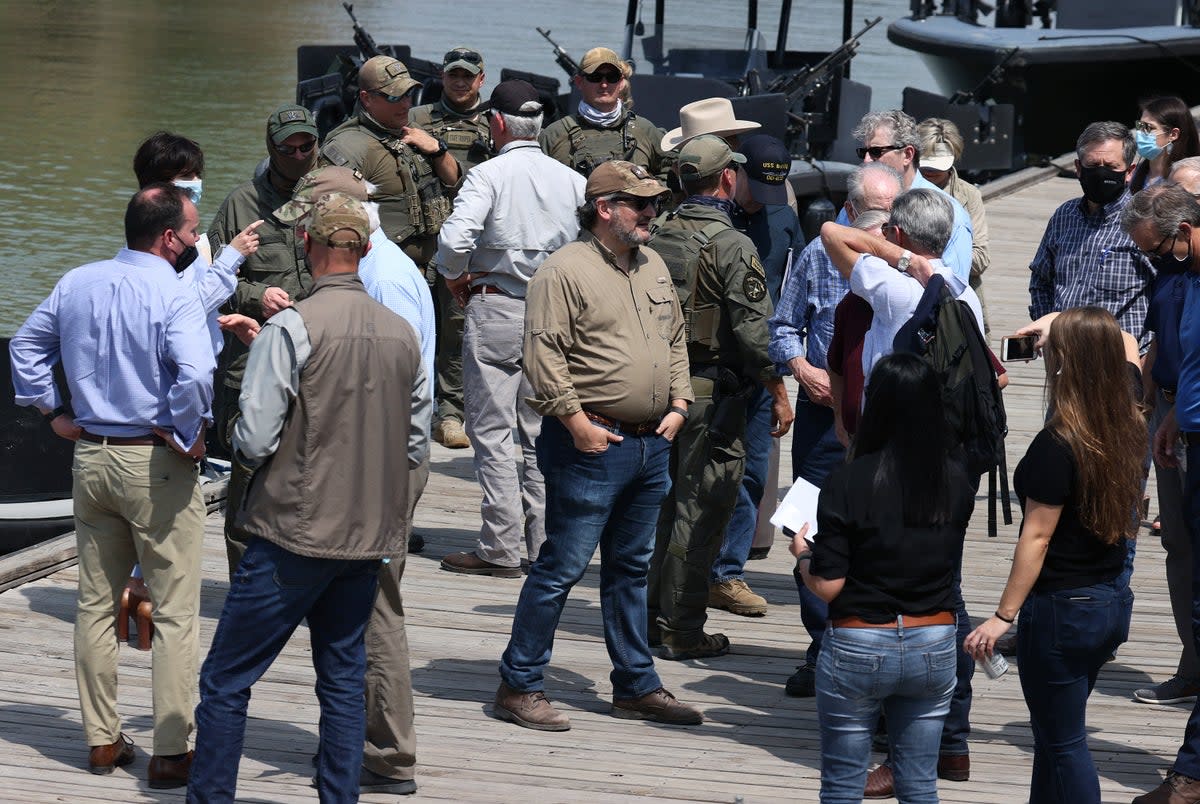 Sen. Ted Cruz (R-TX) (C) stands with other Senators after taking a tour of part of the Rio Grande river on  a Texas Department of Public Safety boat on March 26, 2021 in Mission, Texas (Getty Images)