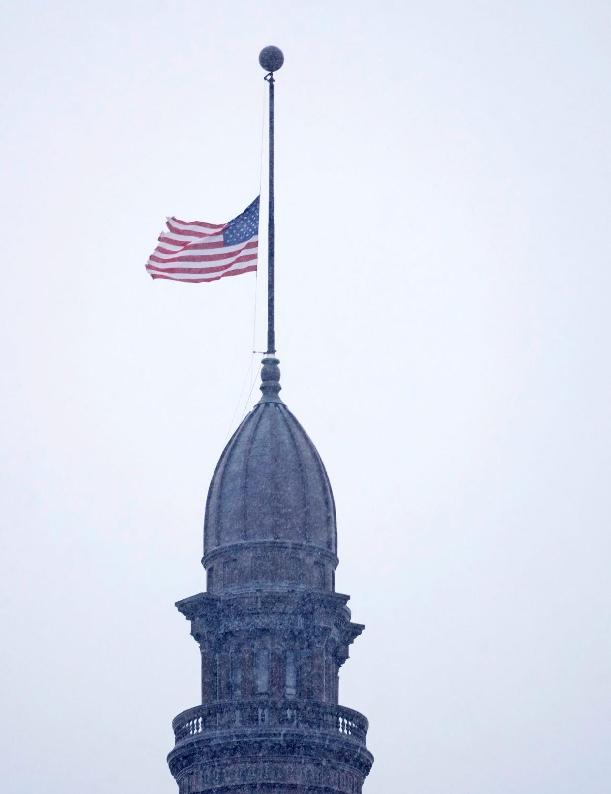 Why are flags flying at halfstaff in Wisconsin today?