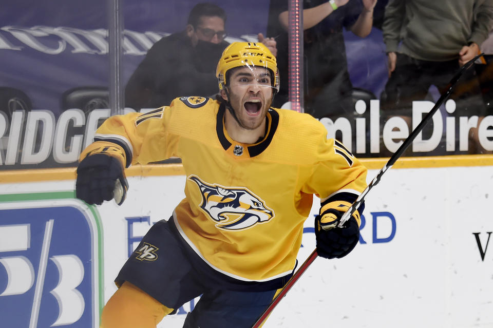 Nashville Predators center Luke Kunin (11) celebrates after scoring a goal against the Carolina Hurricanes during the second period of an NHL hockey game Saturday, May 8, 2021, in Nashville, Tenn. (AP Photo/Mark Zaleski)