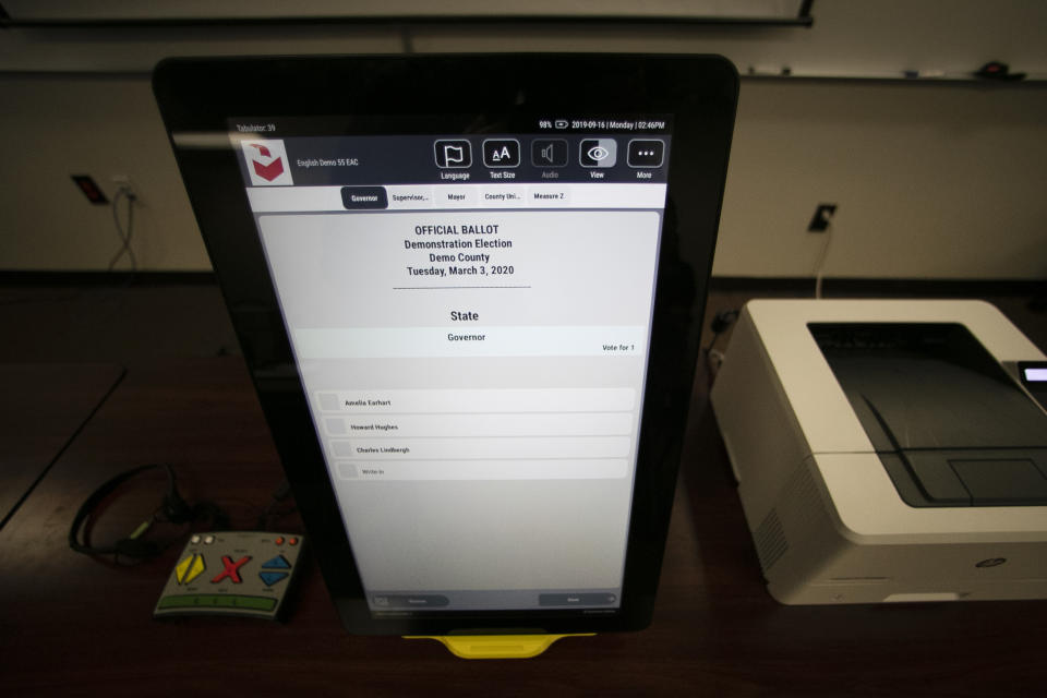 FILE - A sample ballot is shown using the Dominion Voting system Georgia will use, Sept. 16, 2019, in Atlanta, Ga. Testing before and after elections show the voting machines accurately tally the ballots, contradicting a relentless campaign of unfounded conspiracy theories that has undermined confidence in voting equipment throughout the U.S. (AP Photo/John Bazemore, File)