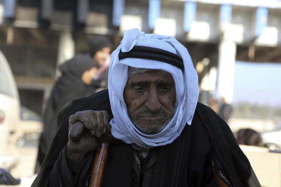 A old Syrian man evacuated from the embattled Syrian city of Aleppo during the ceasefire arrives at a refugee camp in Rashidin, near Idlib, Syria, early Monday, Dec. 19, 2016. The Security Council on Monday approved the deployment of U.N. monitors to the Syrian city of Aleppo as the evacuation of fighters and civilians from the last remaining opposition stronghold resumed after days of delays. (AP Photo)