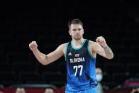 Slovenia's Luka Doncic celebrates at the end of a men's basketball preliminary round game against Spain at the 2020 Summer Olympics, Sunday, Aug. 1, 2021, in Saitama, Japan. (AP Photo/Charlie Neibergall)