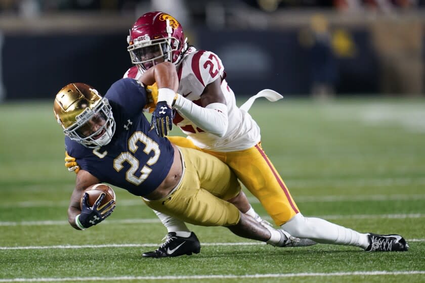 Notre Dame running back Kyren Williams (23) reaches for yardage as Southern California.