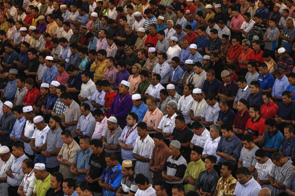 Muslims attend Friday prayers at the National Mosque in Kuala Lumpur