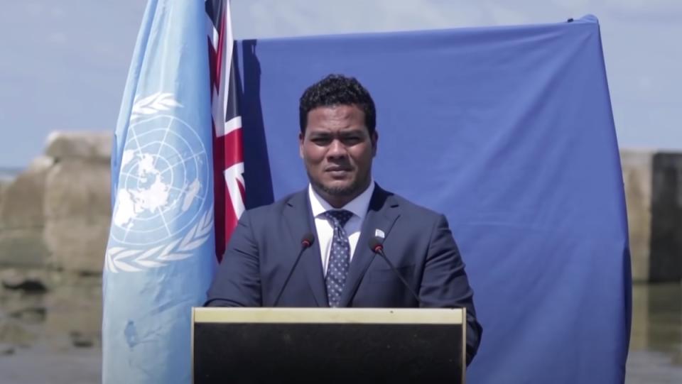 The foreign minister of the island nation of Tuvalu gives a climate change speech knee-deep in ocean water.
