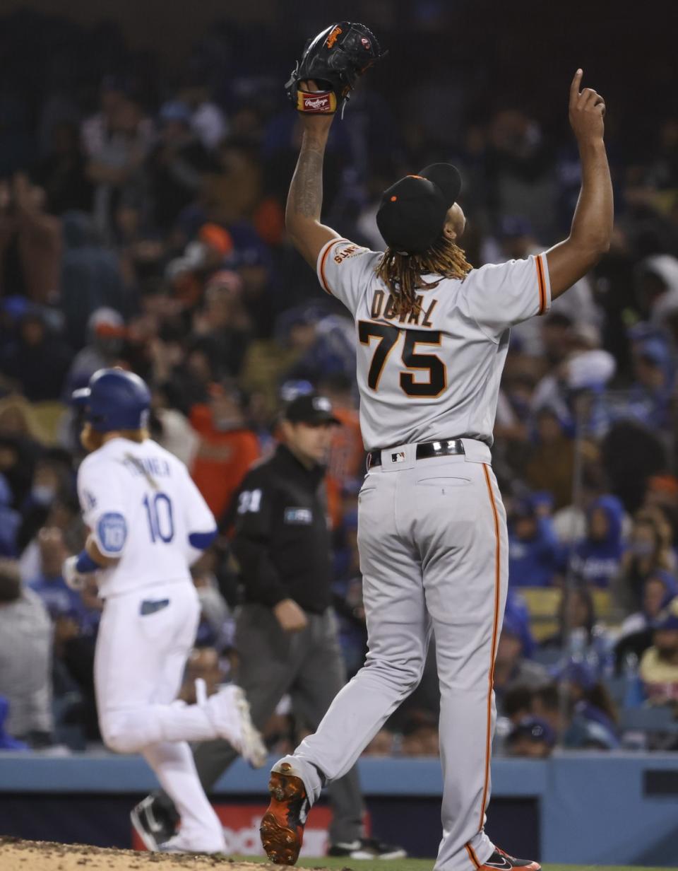 Giants relief pitcher Camilo Doval reacts