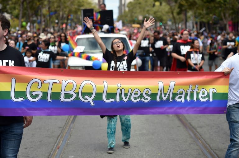 People march during the annual Gay Pride Parade in San Francisco, California, on June 28, 2015