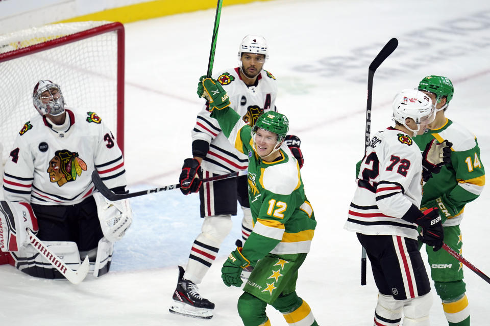 Minnesota Wild left wing Matt Boldy (12) celebrates after scoring during the second period of an NHL hockey game against the Chicago Blackhawks, Sunday, Dec. 3, 2023, in St. Paul, Minn. (AP Photo/Abbie Parr)