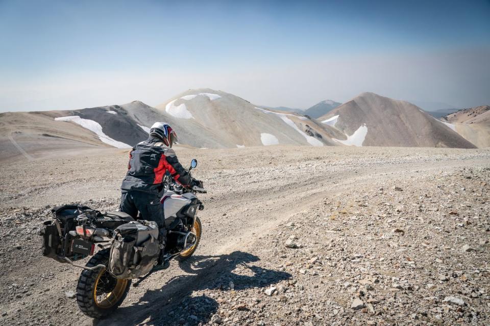 a man on a motorcycle in a desert