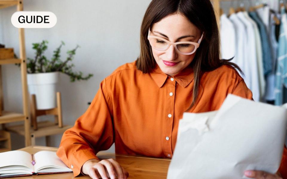 self-employed woman checking her invoices for tax