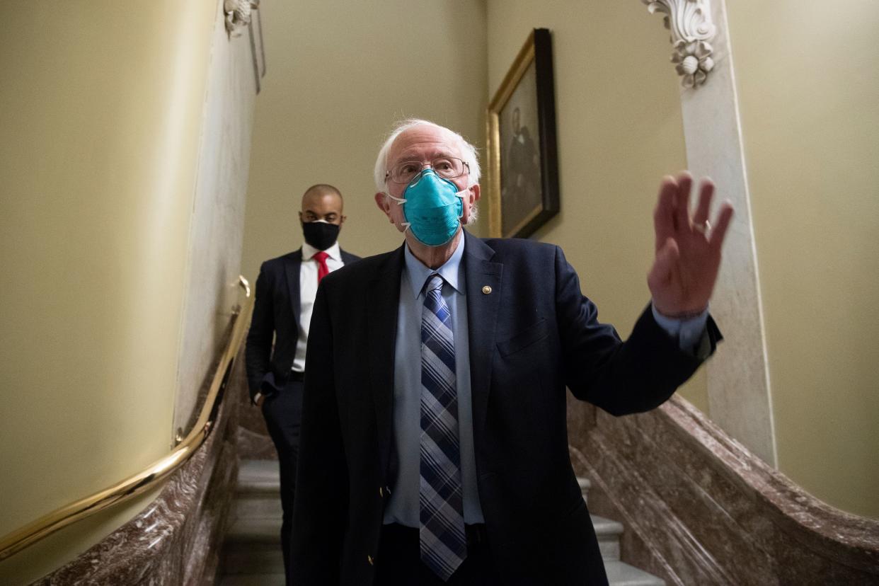 Mandatory Credit: Photo by MICHAEL REYNOLDS/EPA-EFE/Shutterstock (11650752g)Independent Senator from Vermont Bernie Sanders walks from the Senate floor during votes on Capitol Hill in Washington, DC, USA, 20 December 2020.