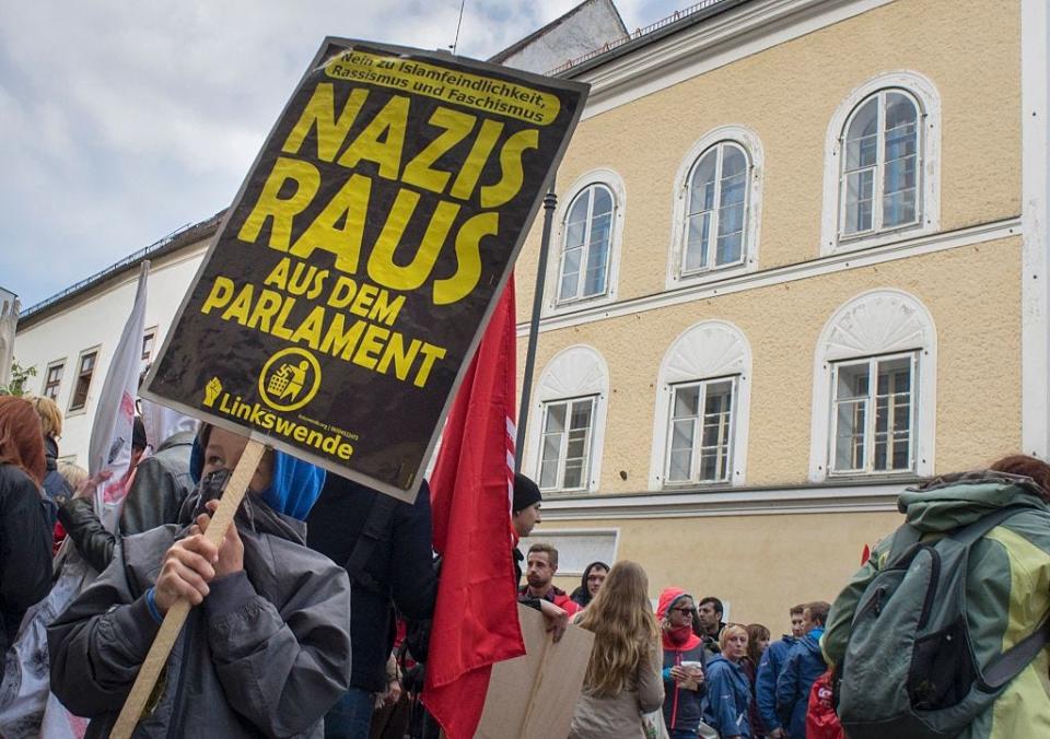 Protesters outside the house where Adolf Hitler was born during anti-Nazi protest in Braunau Am Inn, Austria, on April 18, 2015.