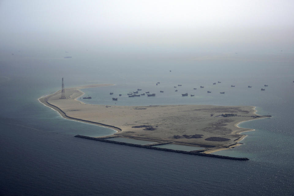Ships sit anchored off Dubai, United Arab Emirates, Friday, May 19, 2023. The Mideast-based chiefs of the U.S., British and French navies transited the Strait of Hormuz on Friday aboard an American warship, a sign of their unified approach to keep the crucial waterway open after Iran seized two oil tankers. (AP Photo/Jon Gambrell)