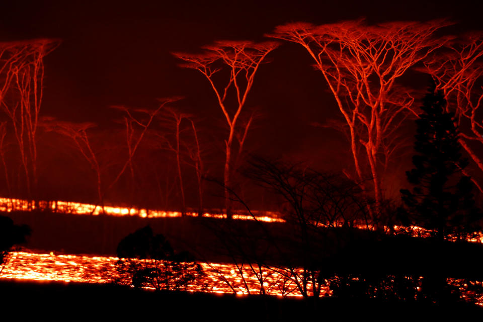 <p>Lava flows on the outskirts of Pahoa during ongoing eruptions of the Kilauea Volcano in Hawaii, June 6, 2018. (Photo: Terray Sylvester/Reuters) </p>