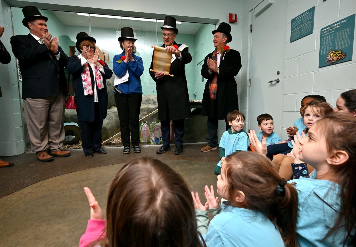 Mayor Joe Petty reads a proclamation at the EcoTarium declaring that there will not be six more weeks of winter. Cornelia the Woodchuck (also called a groundhog) had not seen her shadow earlier that day. She was a diva for the event and would not unwrap herself from her blanket and leave her Amazon box. Also present were, from left, EcoTarium Board Cahir Joe Bartulis, City Councilor Candy Mero-Carlson, EcoTarium President and EO Noreen Smith and Hank Camosse.