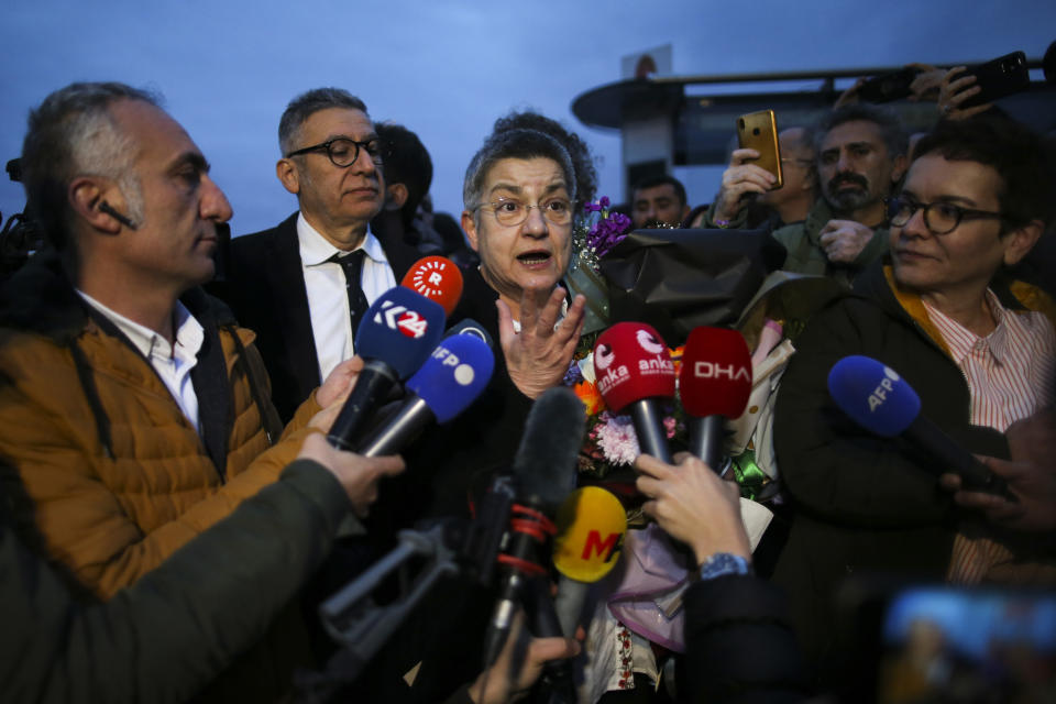 Turkish Medical Association President Dr. Sebnem Korur Fincanci talks to journalists after being released from Bakirkoy women's prison in Istanbul, Turkey, Wednesday, Jan. 11, 2023. A court convicted Fincanci on Wednesday of disseminating "terror organization propaganda" to nearly three years in prison but also ruled to release her from pre-trial detention while she appeals the verdict. (AP Photo/Emrah Gurel)