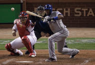 ST LOUIS, MO - OCTOBER 28: Elvis Andrus #1 of the Texas Rangers hits a sacrifice bunt to advance Ian Kinsler #5 in the fifth inning during Game Seven of the MLB World Series against the St. Louis Cardinals at Busch Stadium on October 28, 2011 in St Louis, Missouri. (Photo by Rob Carr/Getty Images)