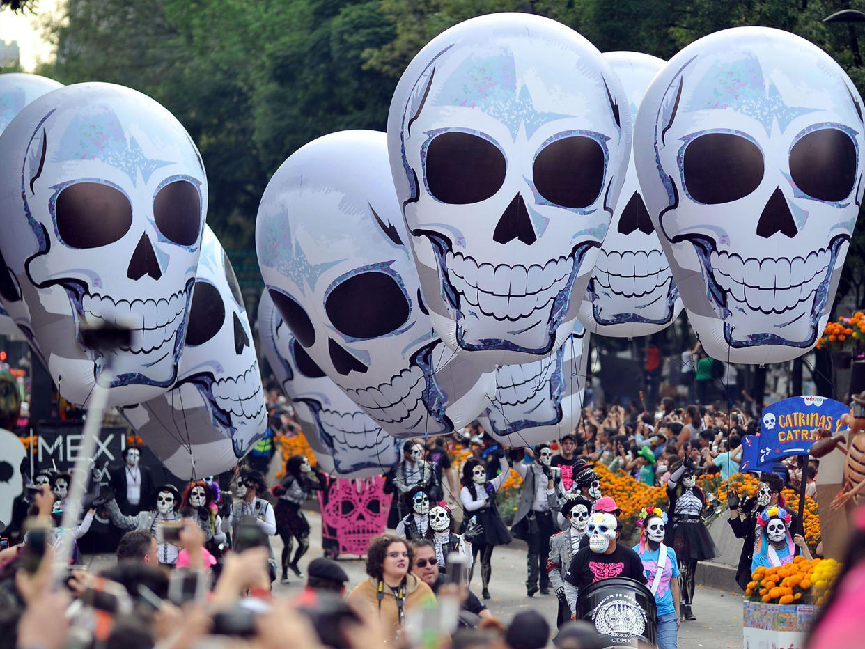 People take part in the Day of the Dead parade in Mexico City: AFP/Getty Images