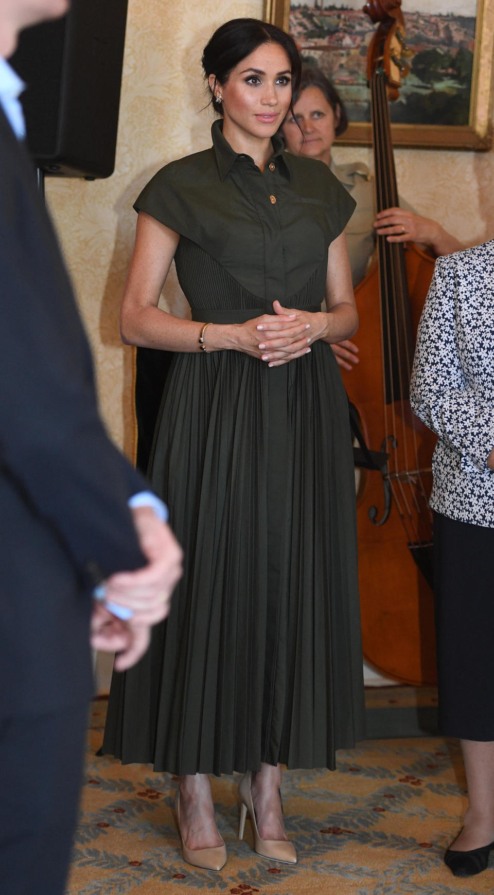 <p>For an afternoon reception at Admiralty House on October 16, The Duchess changed into a £1,728 shirt dress by Brandon Maxwell. She finished the look with a low bun. <em>[Photo: Getty]</em> </p>