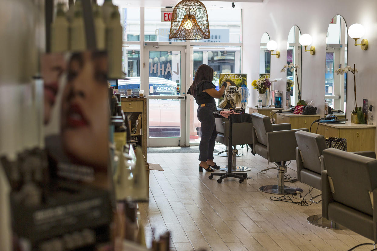 Image: Emily Wands with a customer on July 14, 2021 in Surfside, Fla. (Saul Martinez / for NBC News)