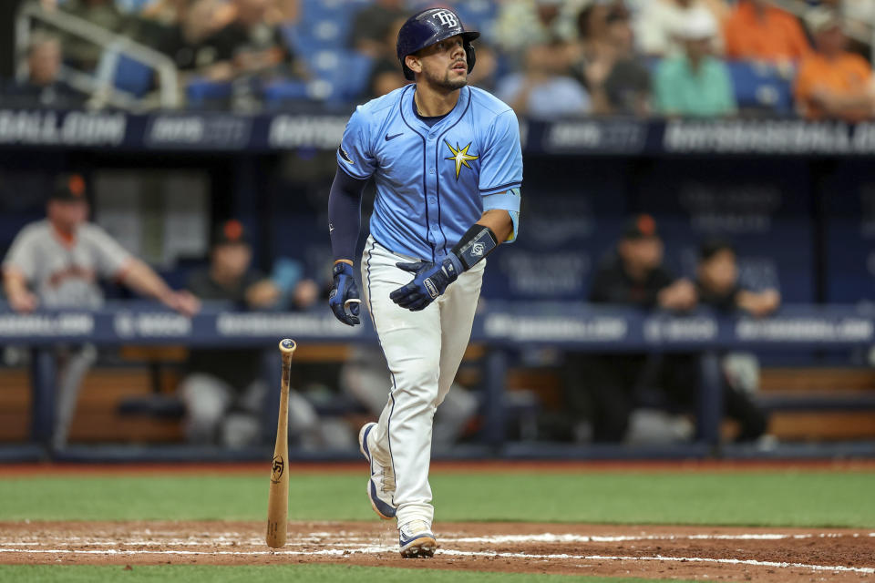 Tampa Bay Rays' Rene Pinto watches his home run against the San Francisco Giants during the sixth inning of a baseball game Sunday, April 14, 2024, in St. Petersburg, Fla. It was Pinto's second home run of the game. (AP Photo/Mike Carlson)