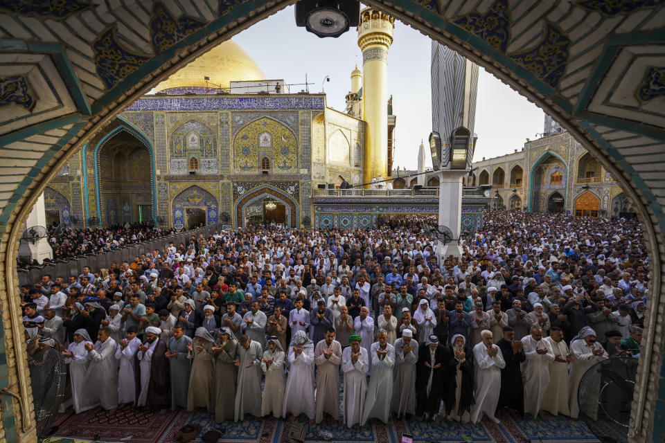 FILE - Shiites attend Eid al-Fitr prayers at Imam Ali shrine in Najaf, Iraq, Saturday, April 22, 2023, to mark the end of the holy Islamic month of Ramadan. (AP Photo/Anmar Khalil, File)