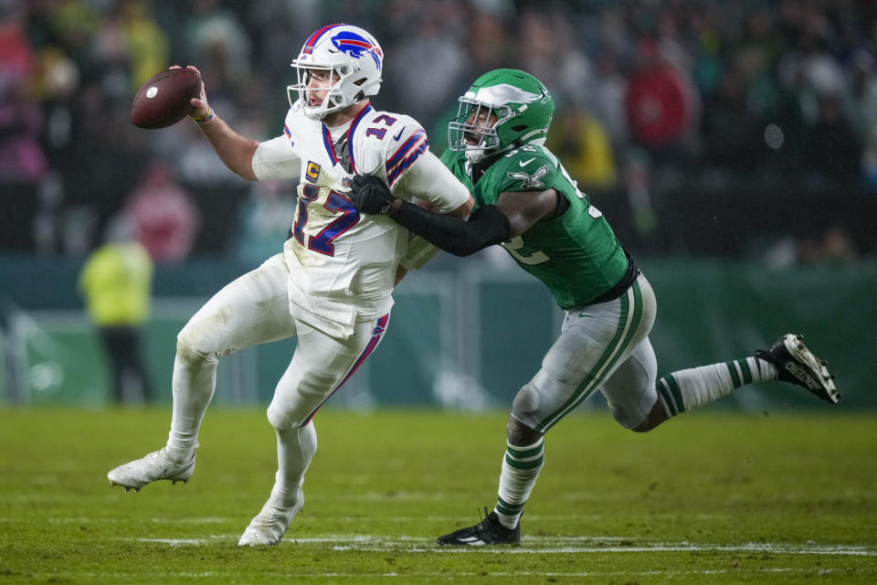 Buffalo Bills quarterback Josh Allen is tackled by Philadelphia Eagles linebacker Zach Cunningham during the first half of an NFL football game Sunday, Nov. 26, 2023, in Philadelphia. (AP Photo/Matt Slocum)