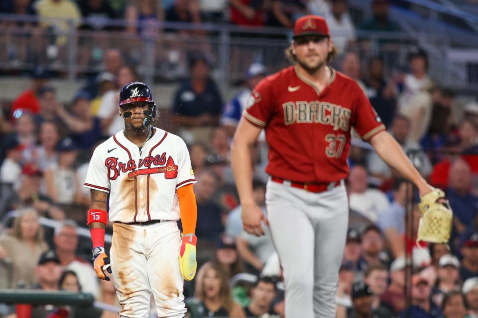 Atlanta Braves right fielder Ronald Acuna Jr. (13) looks at Arizona Diamondbacks relief pitcher Kevin Ginkel (37) in the ninth inning at Truist Park in Atlanta on July 19, 2023.