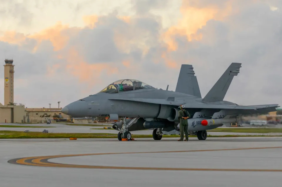 Armed with Harpoon anti-ship missiles, a U.S. Marine Corps F/A-18D Hornet prepares to take off from Andersen Air Force Base Guam, in June 2022, to participate in Exercise Valiant Shield 22. <em>U.S. Marine Corps photo by Cpl. Tyler Harmon</em>