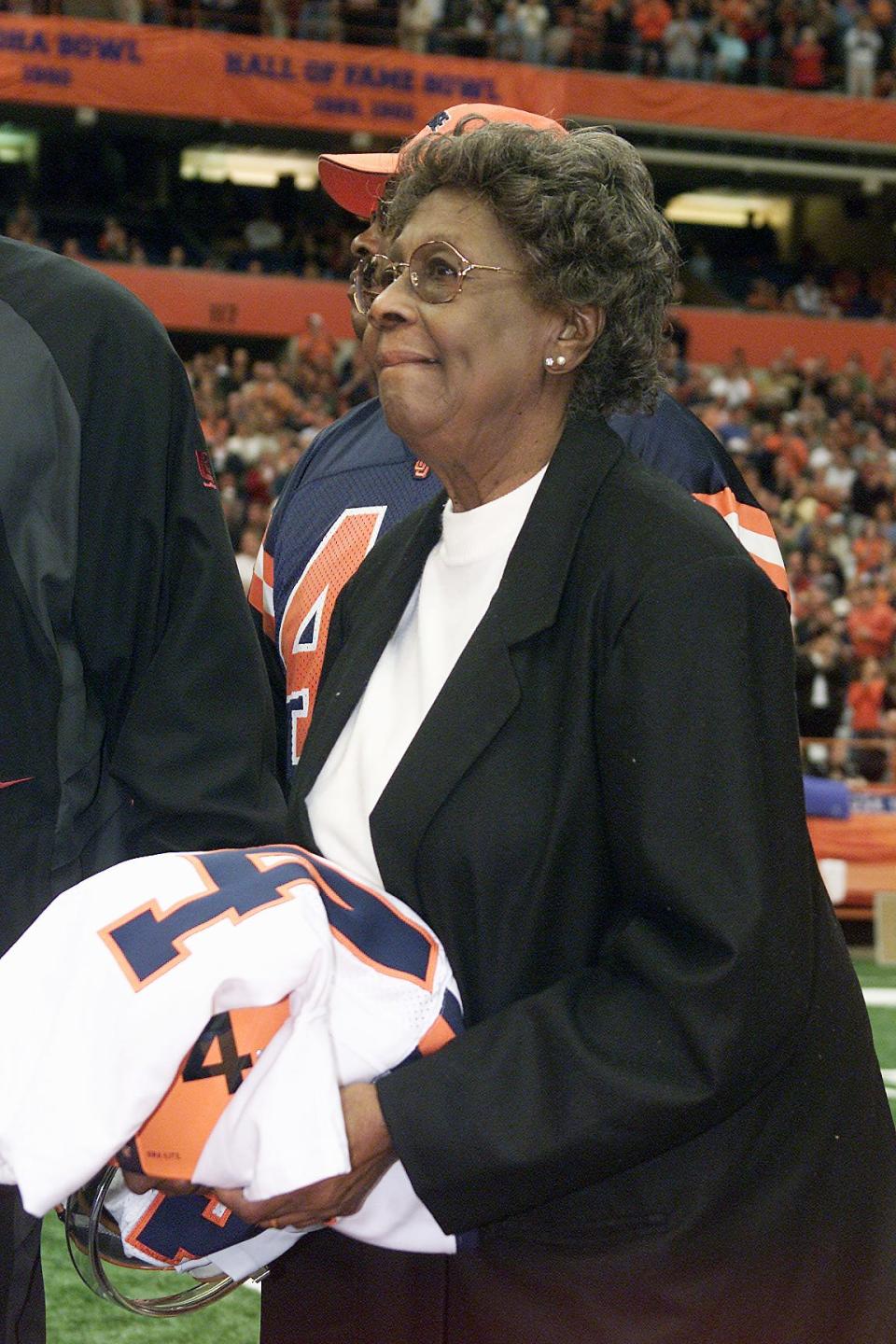 Marie Fleming, the mother of Ernie Davis, waits for the No. 44 jersey to be unveiled and retired at the Carrier Dome in November of 2005.