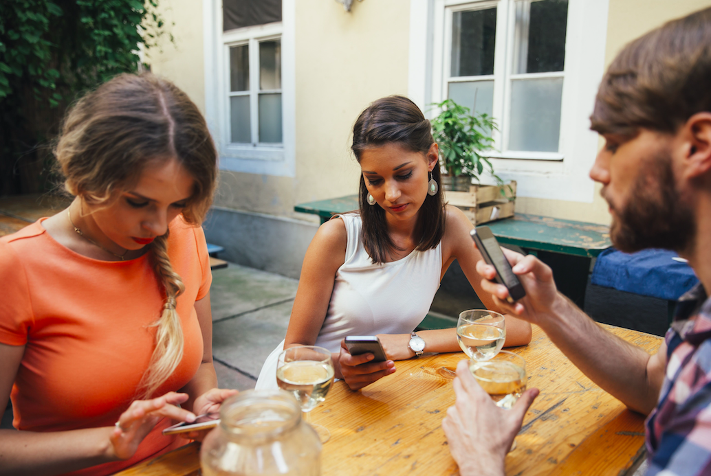 <em>Mobile phones have been banned from a pub in Kent (Rex/posed by models)</em>