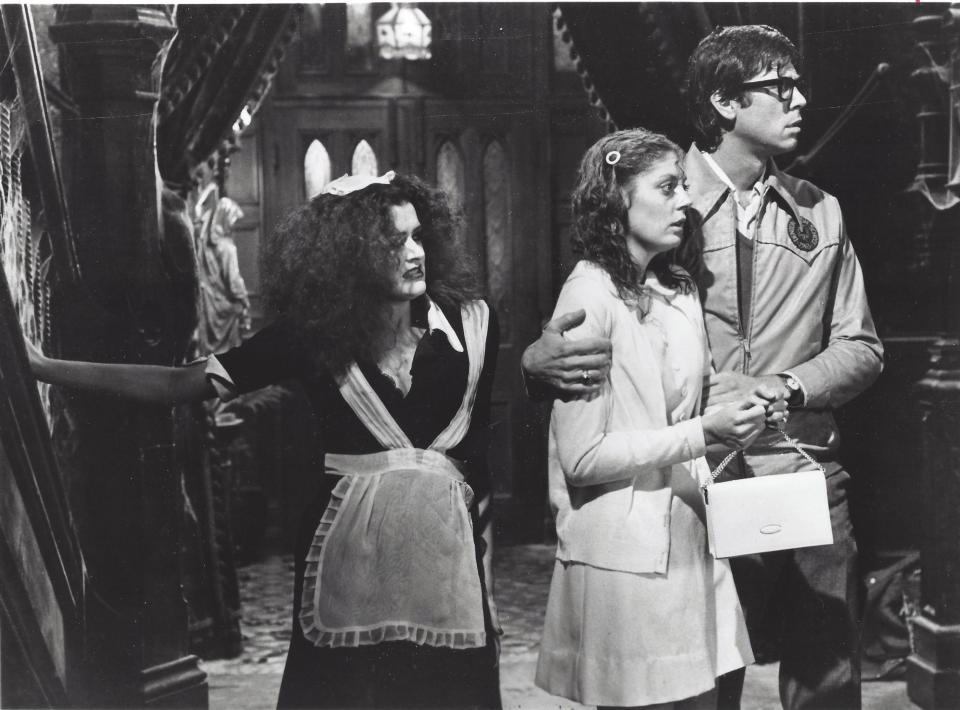 Magenta (Patricia Quinn), left, Janet (Susan Sarandon) and Brad (Barry Bostwick) hear weird music in the mansion in this scene from the 1975 film "The Rocky Horror Picture Show."