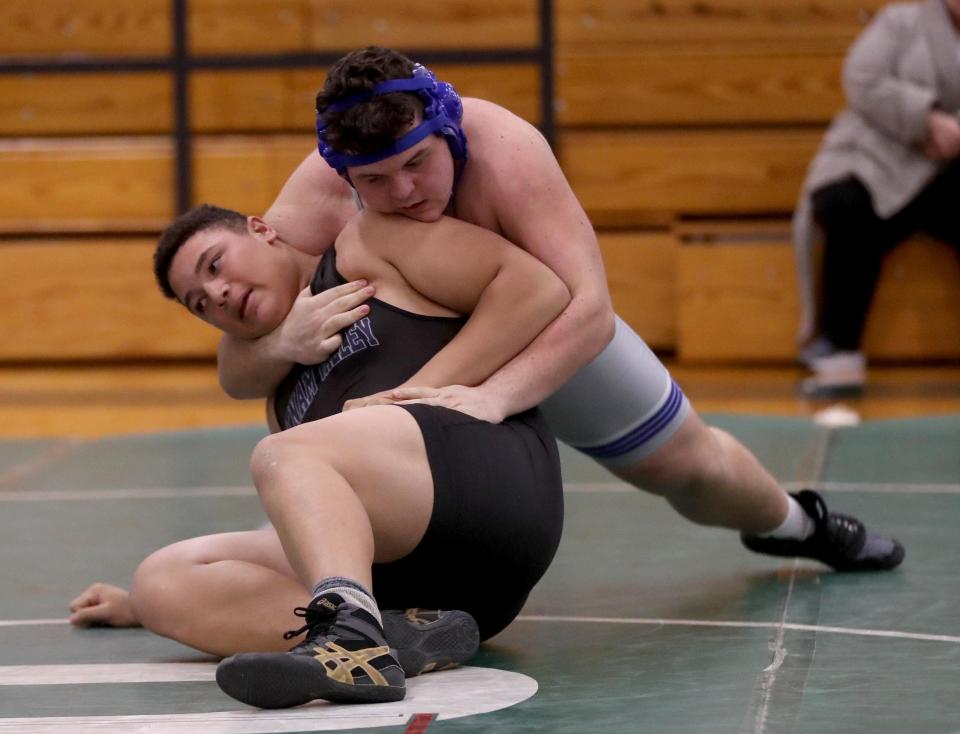 Hendrick Hudson's Mason Dietz and Putnam Valley's Jaden Tesher battle in an 285-pound match during a dual wrestling meet at Pleasantville High School Dec. 13, 2022.