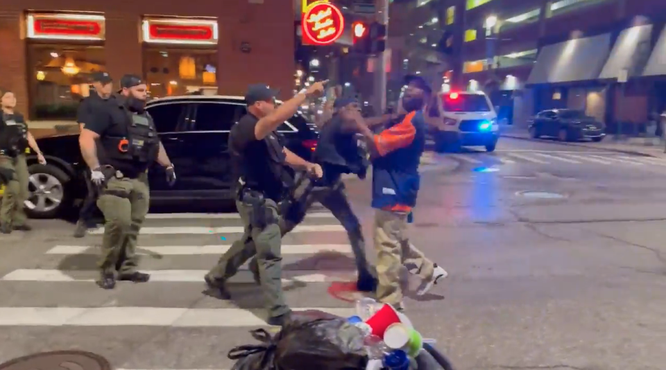 A video recorded Sunday shows officers approach a man in a Detroit Tigers' shirt, who appeared to be speaking to them when an officer struck him in the face, knocking him to the ground. (via WDIV)