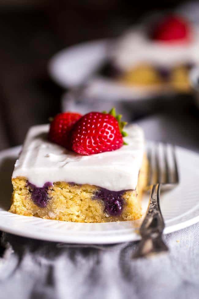 Paleo Poke Cake With Blueberries, Strawberries, And Coconut Cream