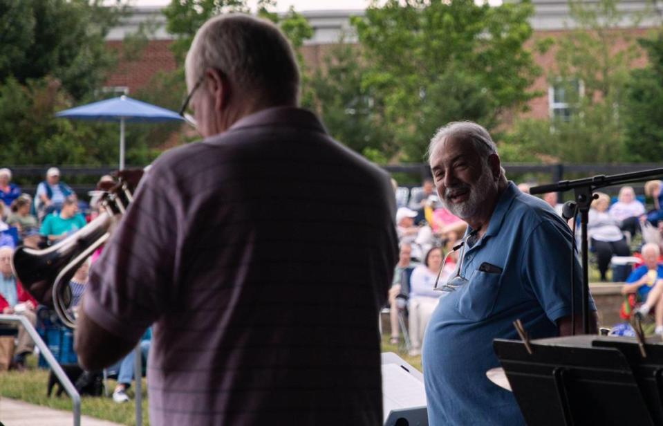 Vince DiMartino of the The DiMartino-Osland Jazz Orchestra looks over at his fellow players during their show at the weekly Big Band and Jazz performance at the MoonDance Amphitheater in Lexington, Ky., on June 1, 2021.