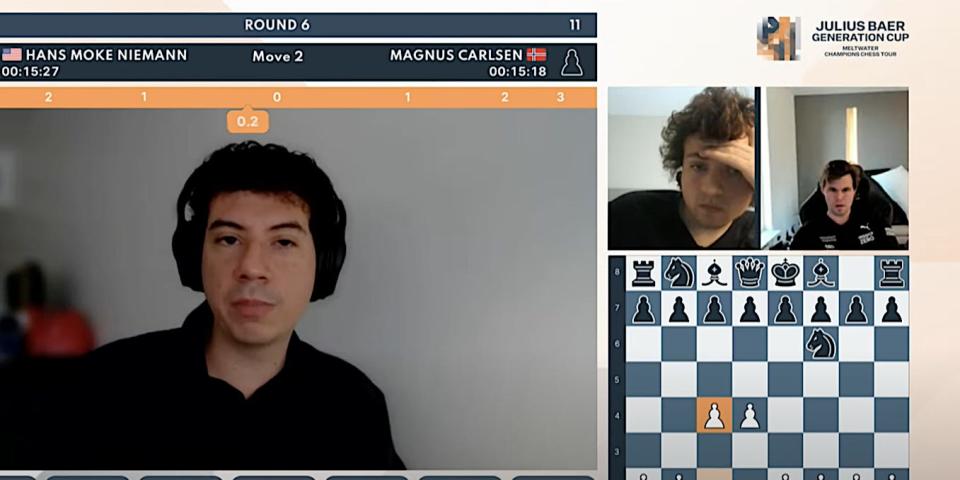 Screenshot shows a commentator talking during an online chess match between Hans Niemann and Magnus Carlsen, who are shown in two smaller windows