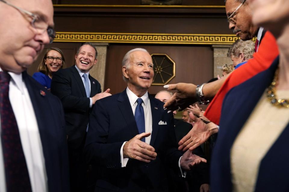 Biden mingles with members of Congress.