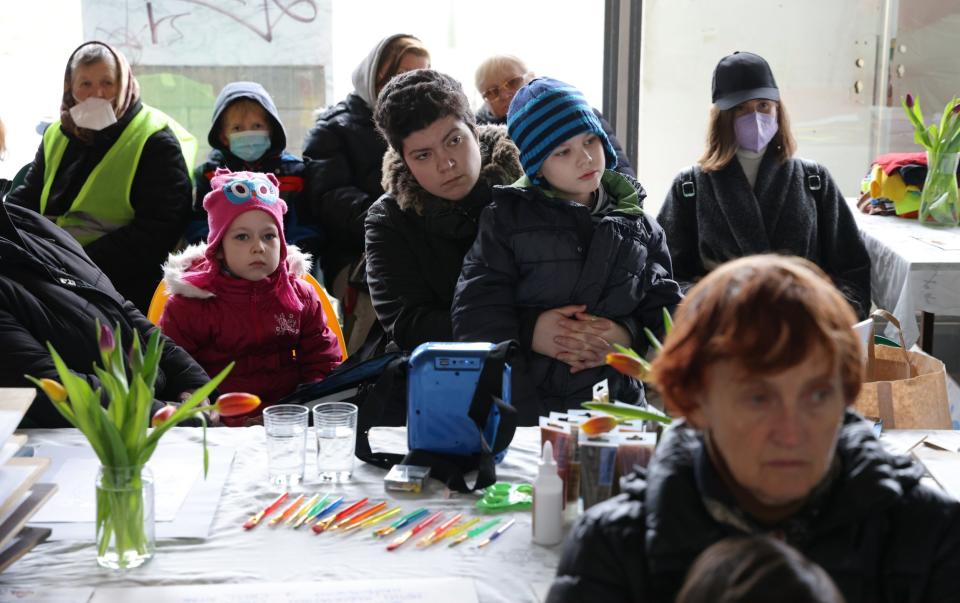 Ukrainian women and children at Cafe Ukraine in Berlin, set up by Natalia Kovalenko, who fled Mariupol, and childhood friend Olena Nominas, who fled Zaporizhzhia - Sean Gallup/Getty Images