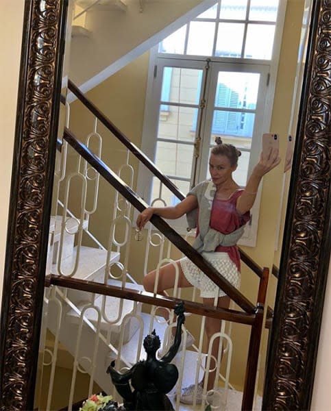 Kylie Minogue on a staircase